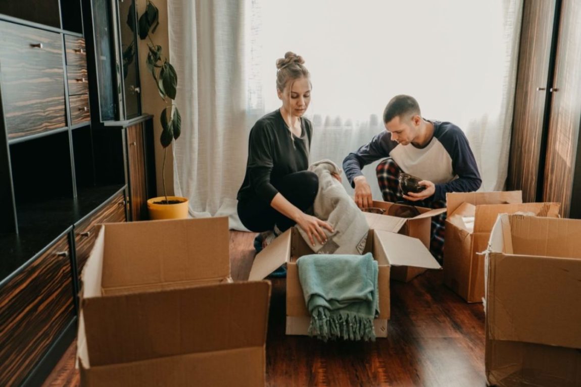 Young couple packing to move across the country.