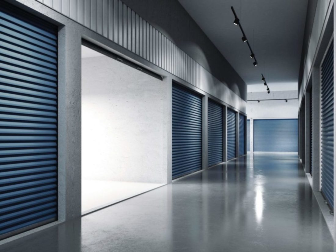An open storage unit rental in a row of storage spaces